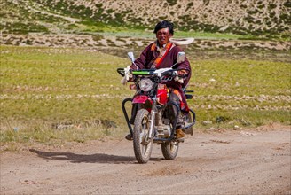 Men on a motorbike along the southern route into Western Tibet