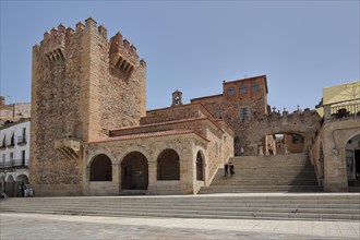 Historic city fortification with tower Torre de Bujaco and archway Arco de la Estrella