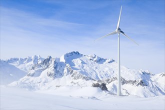 Wind turbine on the Rohrspitz above Andermatt with view to the Dammstock