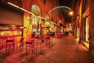 Street cafe in the pedestrian zone with Christmas lights