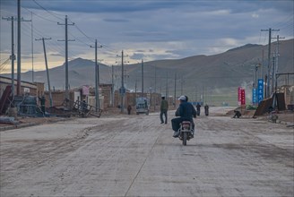 Men on a motorbike along the southern route into Western Tibet