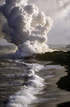 Lava Flow from Kilauea Flowing into the Sea on the East Side of the Island Forming a Plume of Steam and Noxious Gasses