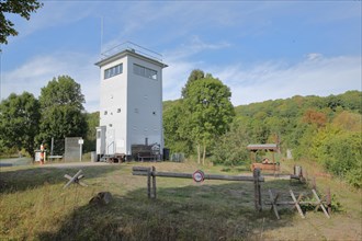 Inner German border of the former GDR with observation tower and barrier