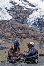 Pilgrims taking a break on the Karo-La Pass along the Friendship Highway