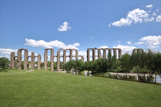 Roman aqueduct Acueducto de los Milagros over the Rio Albarregas