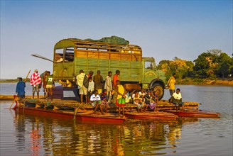 Truck crossing on a improvised ferry the Manambolo river