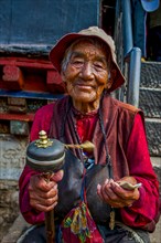 Old tibetan pilgrim walking on the Barkhor