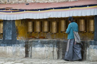 Old tibetan pilgrim in the Drepung temple