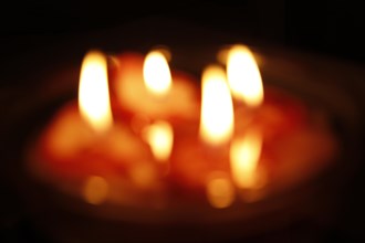 Burning candles in a bowl