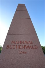 Obelisk and signpost with inscription memorial