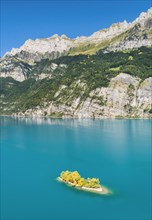 Aerial view of Lake Walen with a view of Chive Island in the turquoise water and mountains with Leistchamm in the background