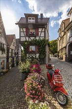 Half-timbered houses and Vespa scooters in Gengenbach