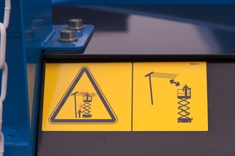 Warning signs on construction machinery