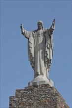 Statue with Jesus on Stone