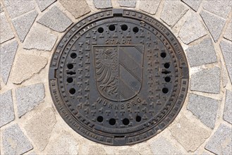 Manhole cover with the Nuremberg city coat of arms