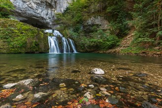 Waterfall from the source of the Lison in a haven of tranquillity with its waterfall surrounded by woods. Nans-sous-Sainte-Anne