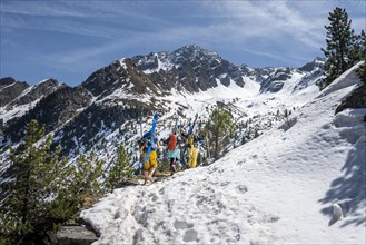 Ski tourers hiking in spring with little snow