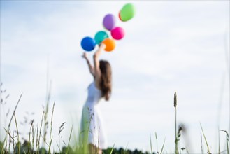 Little girl with balloons. Summer holidays