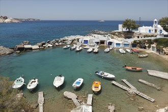 The Quaint Fishing Village with the Colorful Syrmata Boathouses in the small village of Mandraki on the island of Milos