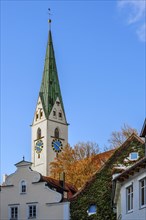 Autumn atmosphere around the tower of St. Mang Church