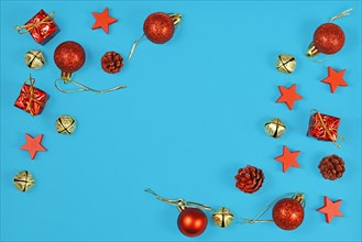 Christmas flat lay with red ornaments in shape of tree baubles