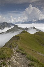 View from Gehrengrat over the fog-shrouded peaks of the Alps. Lech