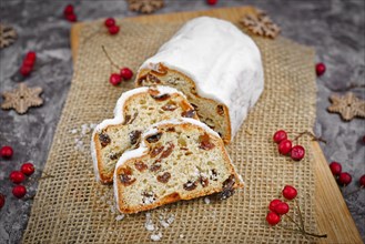 Slices of traditional German christmas season sweet food called Stollen or Christstollen