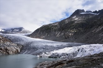 Rhone glacier partially covered with white tarpaulins to protect it from melting