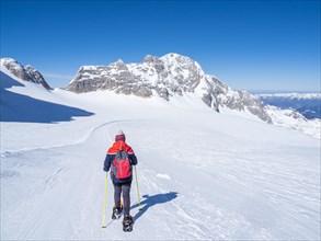 Snowshoe hiker on the Hallstaetter Glacier