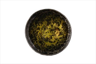 Top view of forged saucer with olive oil