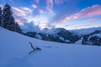Winter landscape on the Jaun Pass with a view of the Gastlosen after sunset