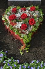 Grave with heart-shaped flower decoration