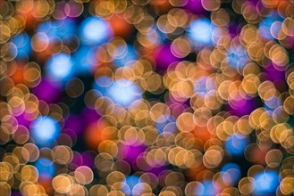 Christmas abstract blurred background. Multi-colored lights. Unfocused image. Christmas tree garland in a blur