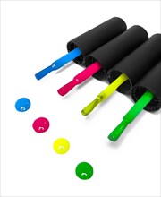 Four multi-colored nail polishes on a white background. Color drops. Close-up. Nail Salon