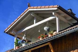 Dormer with flower decorations and odds and ends