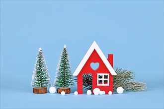 Winter decoration with small red house
