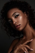 Beautiful African American woman with trendy makeup