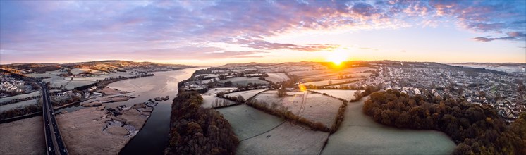Sunrise over Bridge and Marshland of River Teign shrouded in frost from a drone