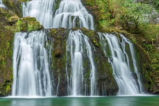 Waterfall from the source of the Lison in a haven of tranquillity with its waterfall surrounded by woods. Nans-sous-Sainte-Anne