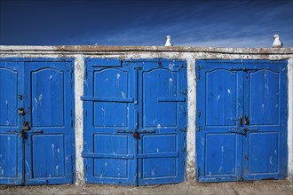 Blue doors with padlock