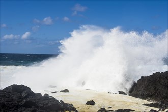 Huge waves crushing on the lava rocks