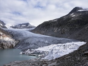 Rhone glacier partially covered with white tarpaulins to protect it from melting