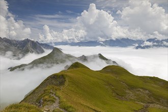 View from Gehrengrat over the fog-shrouded peaks of the Alps. Lech