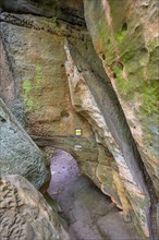 Low passage at the sandstone cliffs of