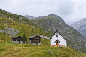 Neo-Gothic chapel on Luesgen with two wooden chalets