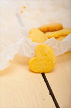 Fresh baked heart shaped shortbread valentine day cookies on a paper wrap