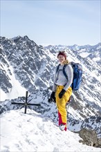 Mountaineer at the summit of the Sulzkogel