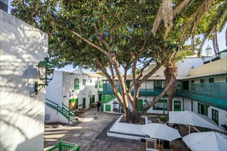 Picturesque white and green settlement called Pueblo Marinero designed by Cesar Manrique located in Costa Teguise