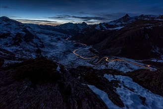 Night photograph with light traces of vehicles on the pass road of the Julier Pass