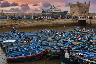 Traditional blue fishing boats in the fishing port